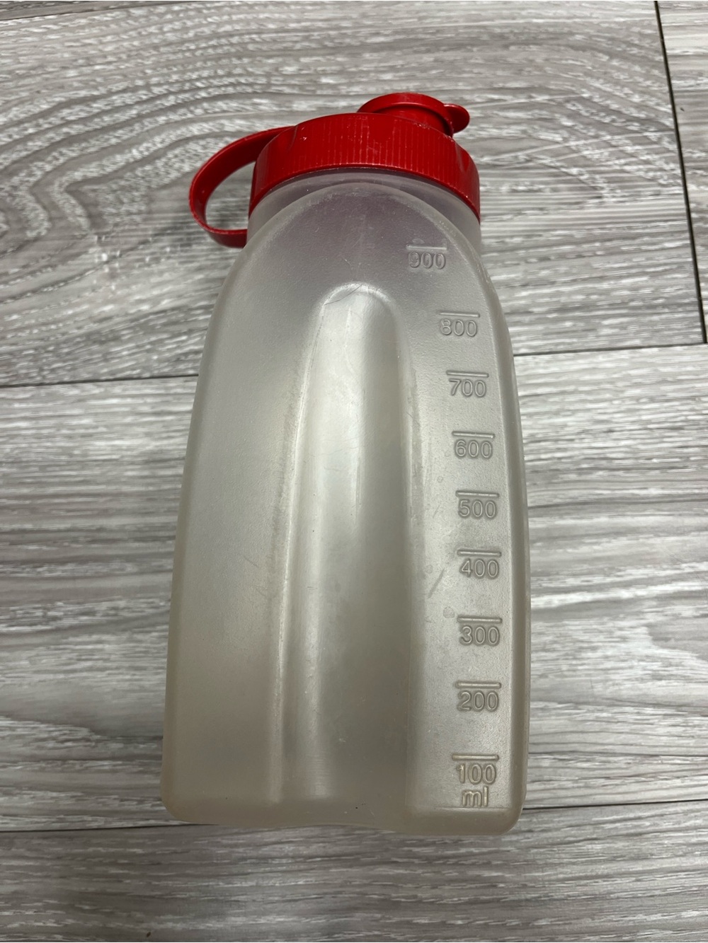 Rubbermaid Translucent White Plastic Bottle with Red Screw Cap